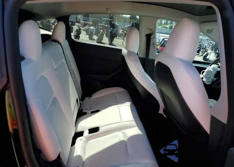 2023 Tesla Model Y from USA, damaged, VIN 7SAYGDED8PF967651